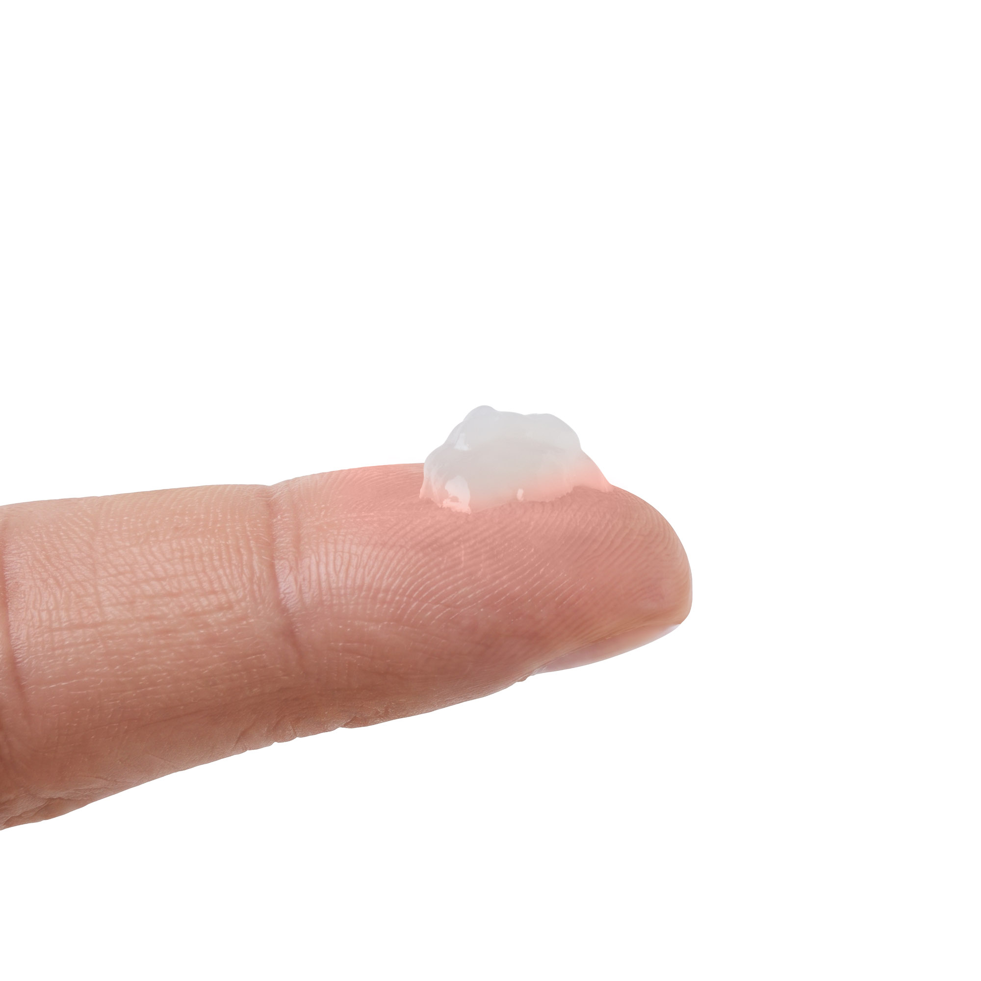 A pea-sized amount of Men's Instant Facelift serum on a fingertip, showing how little you need